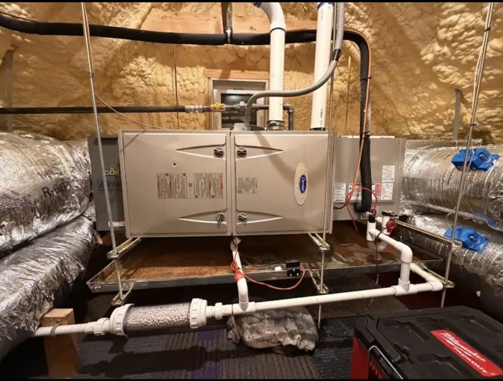 Horizontal air handler connected to insulated ductwork in an attic
