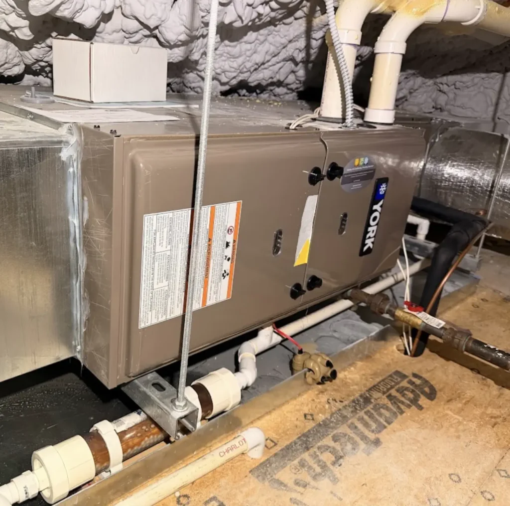 Horizontal furnace and air handler installed in an attic with drain and duct connections