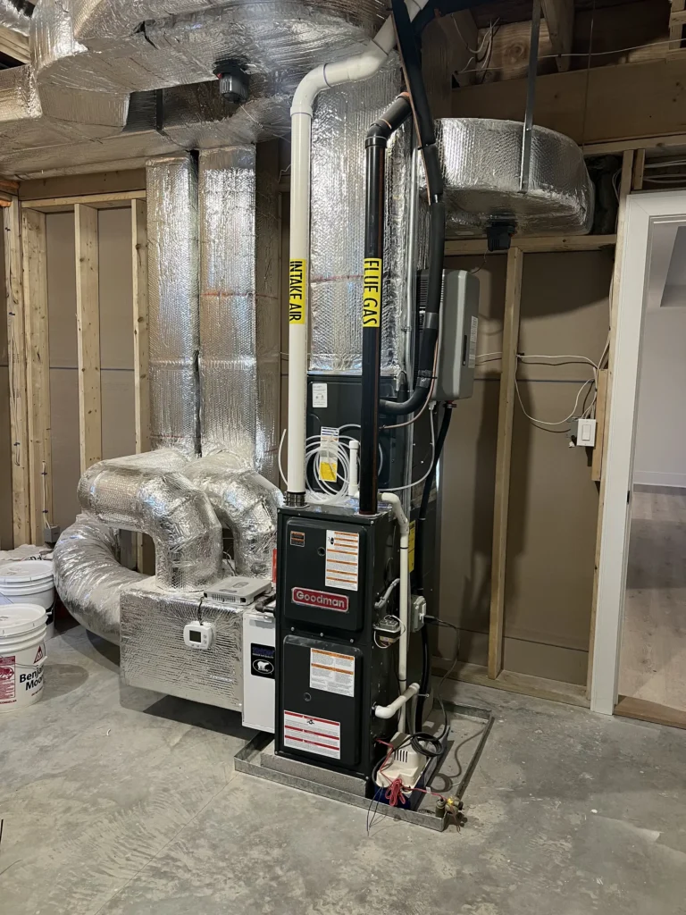Basement furnace installation connected to insulated supply and return ductwork