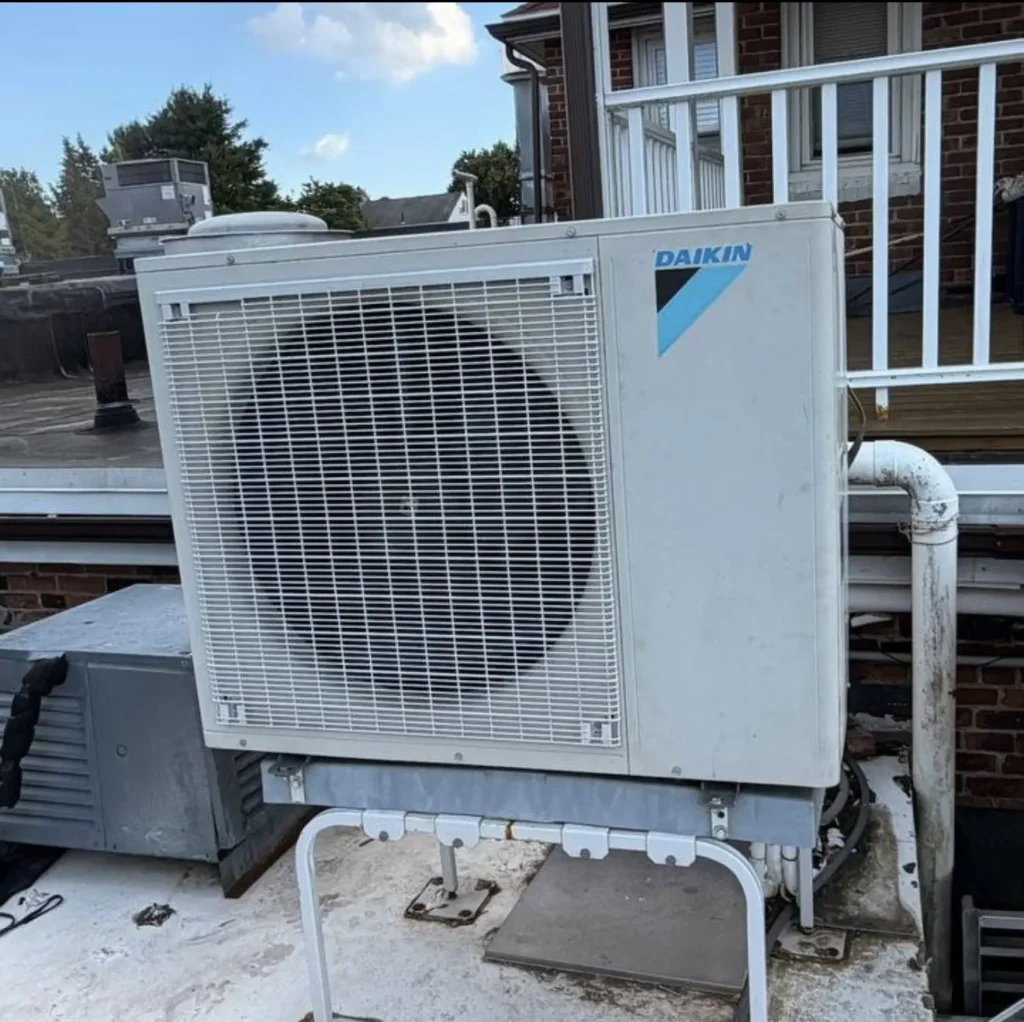 Daikin ductless mini-split outdoor condenser installed on a rooftop stand