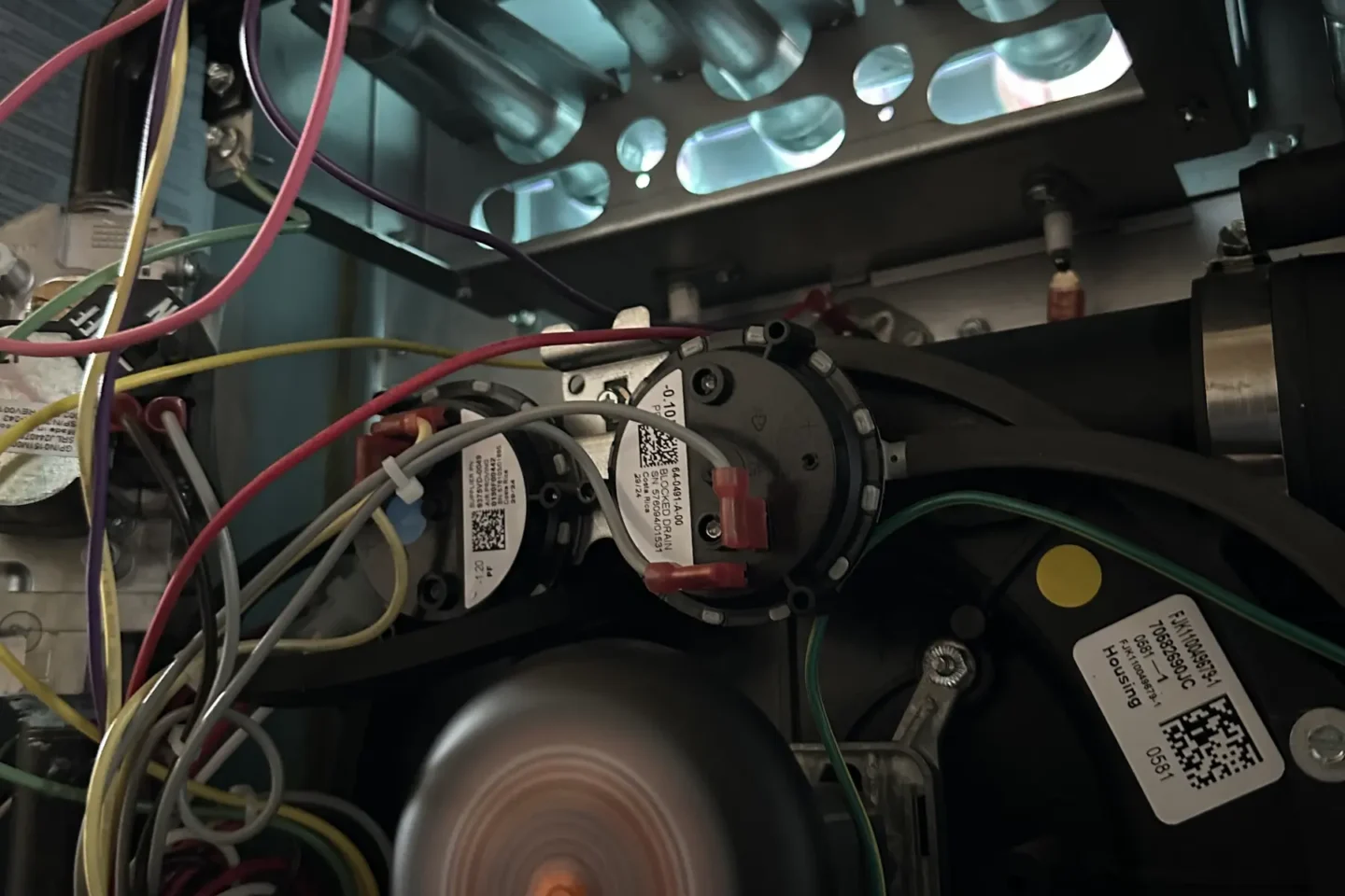 Operating furnace blower assembly exposed during heating-system repair