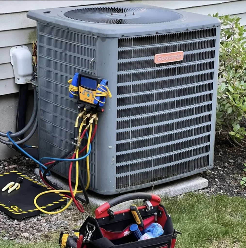Goodman outdoor AC condenser connected to digital service gauges
