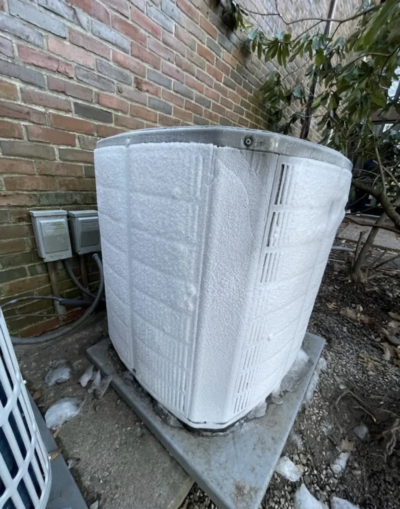 Residential outdoor condenser installed on a narrow side yard pad