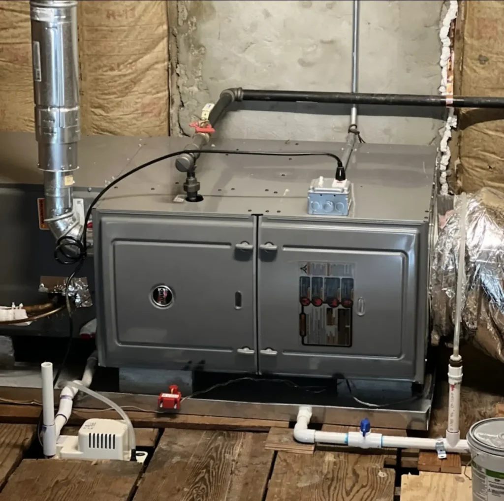 Ruud horizontal furnace installed with venting, ductwork, and condensate pump